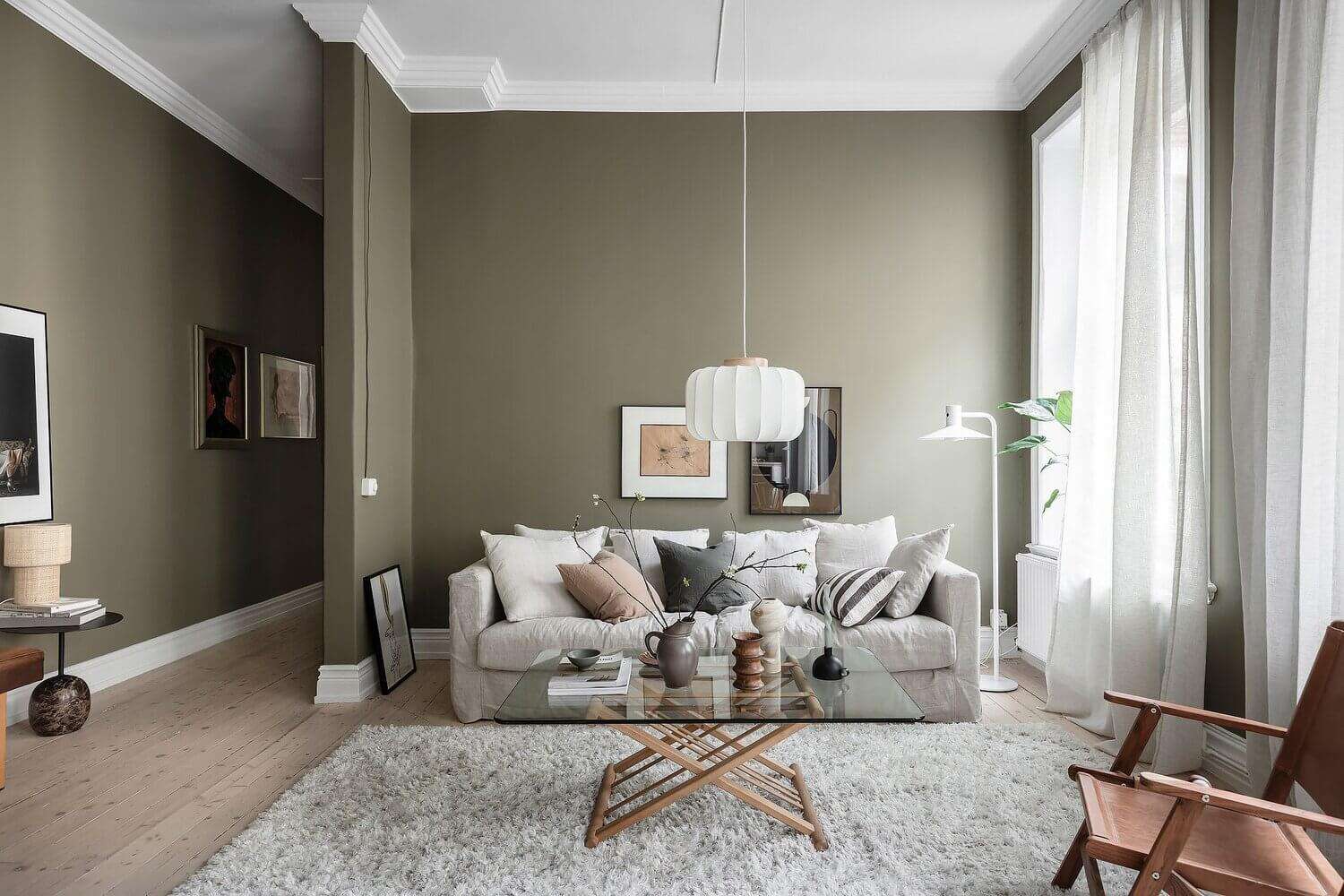 40 Best Sage Green Living Room Ideas to Inspire You 105 40 Best Sage Green Living Room Ideas to Inspire You AScandinavianApartmentWithOliveGreenWalls TheNordroom Sage Green Living Room