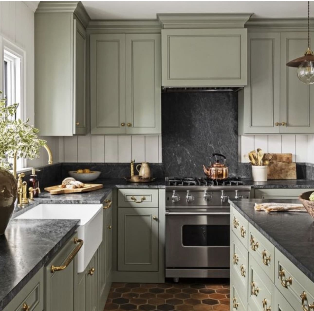 34 Beautiful Sage Green Kitchen Design Ideas to Inspire You 29 34 Beautiful Sage Green Kitchen Design Ideas to Inspire You Sage Green Kitchen Cabinet Against Black Slabs