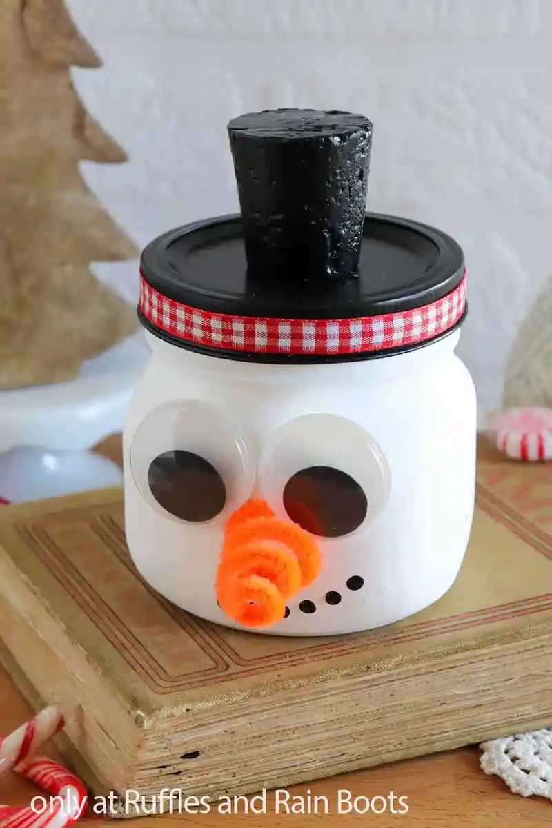 24 Easy & Fun Winter Crafts for Kids of All Ages 65 24 Easy & Fun Winter Crafts for Kids of All Ages Painted snowman mason jar craft for kids Winter Crafts for Kids